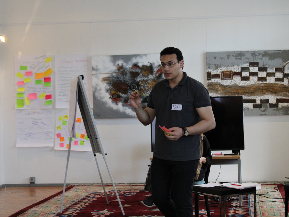 Sakr leading a session at the flipchart